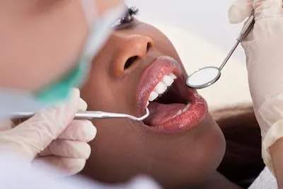 woman receiving a preventive dental cleaning