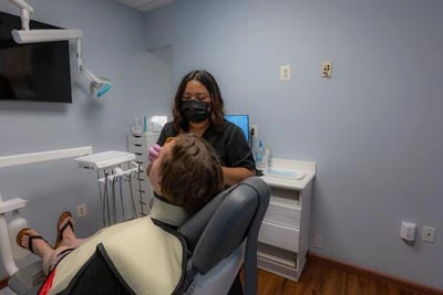 patient receiving a chemotherapeutic rinse at New Life Dental in Germantown, MD