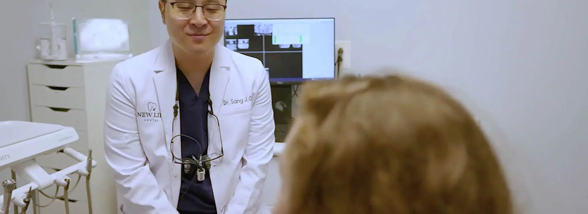 Dr. Cho with dental patient at consult